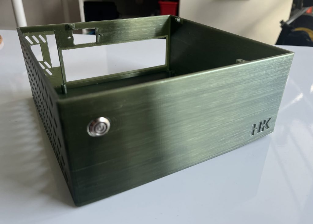 Front of Mini PC Case with 'HK' initials embedded
