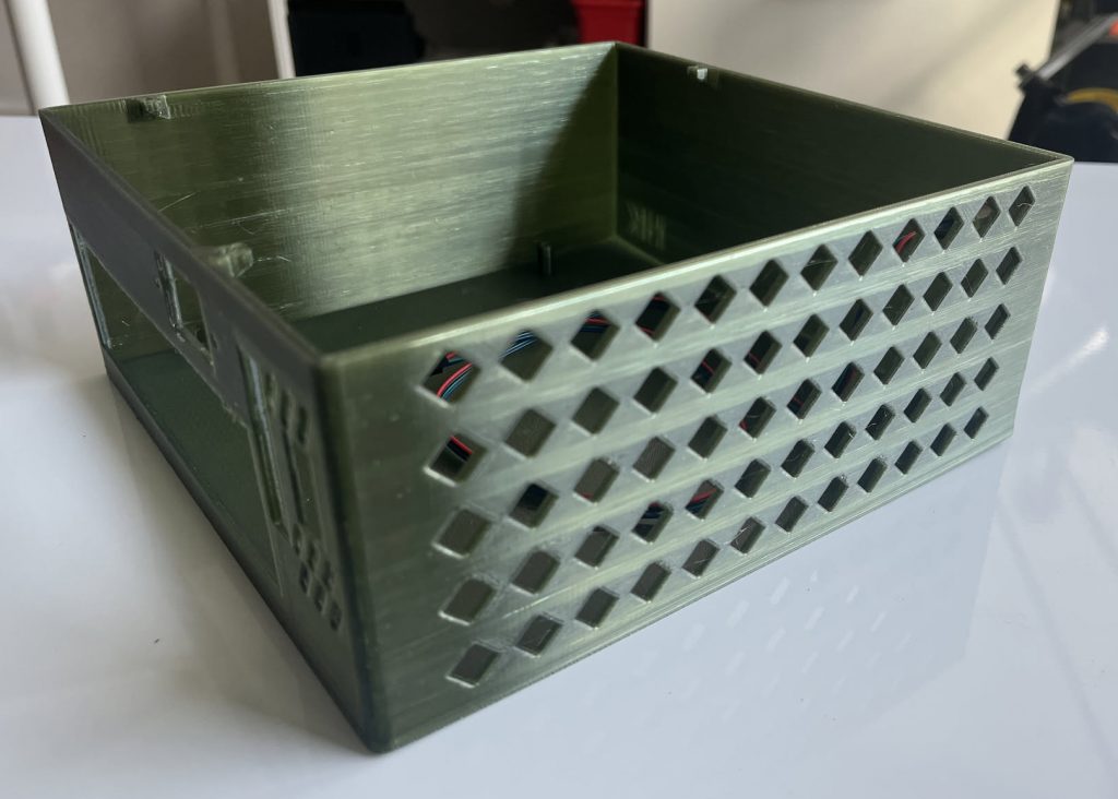 Side of the Mini PC Case with cutouts for airflow